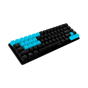 angled view of HyperX rubber keycaps in blue with keyboard lighting off