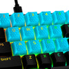 closeup view of HyperX rubber keycaps in blue on a lit keyboard